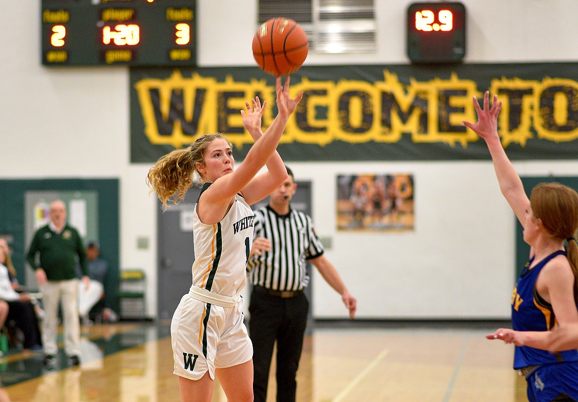 Bulldog senior Brooke Roberts shoots a 3-pointer in a game against Libby on Thursday in Whitefish. (Whitney England/Whitefish Pilot)