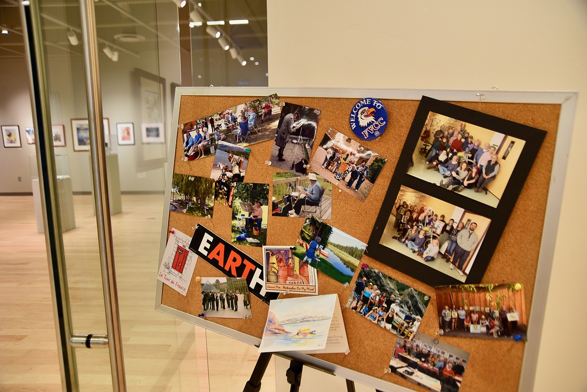 A bulletin board outside the Wanda Hollensteiner Art  Gallery at Flathead Valley Community College shows off photographs of art instructor Karen Leigh in class and on various painting field trips. (Heidi Desch/Daily Inter Lake)