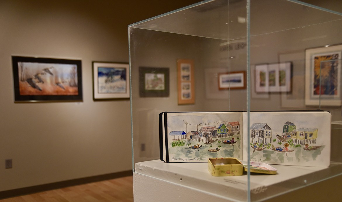 A watercolor sketchbook by Rosemary McKinnon, one of Flathead Valley Community College instructor Karen Leigh’s students, is part of the exhibit honoring Leigh’s career as an educator. (Heidi Desch/Daily Inter Lake)