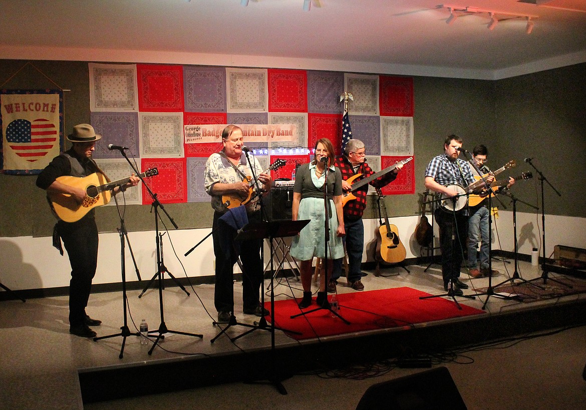 The Badger Mountain Dry Band performs Saturday at the George Community Hall. From left: Guest guitarist Joe Smart, band leader Jim Honeyman, vocalist Kay Humphrys, Mike Zabel on bass, Nick McLean on banjo and Shawn Hughes, who played fiddle, mandolin and octave mandolin as well as guitar.