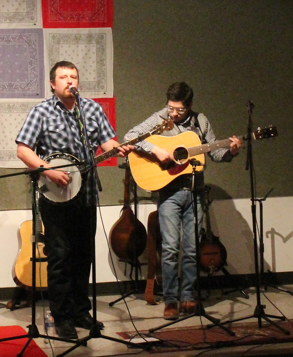 Nick McLean, left, picks banjo and sings his own composition, “Woe is Me,” about the plight of coal miners in Roslyn. Fiddler Shawn Hughes switched to guitar for the song.