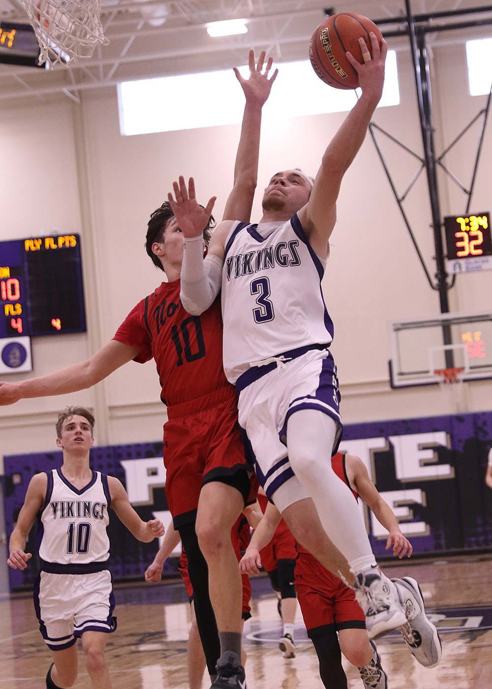 Charlo's Keaton Piedalue makes the lay-up against Noxon during the 14C District Tournament, held in Polson last weekend. (Bob Gunderson photo)