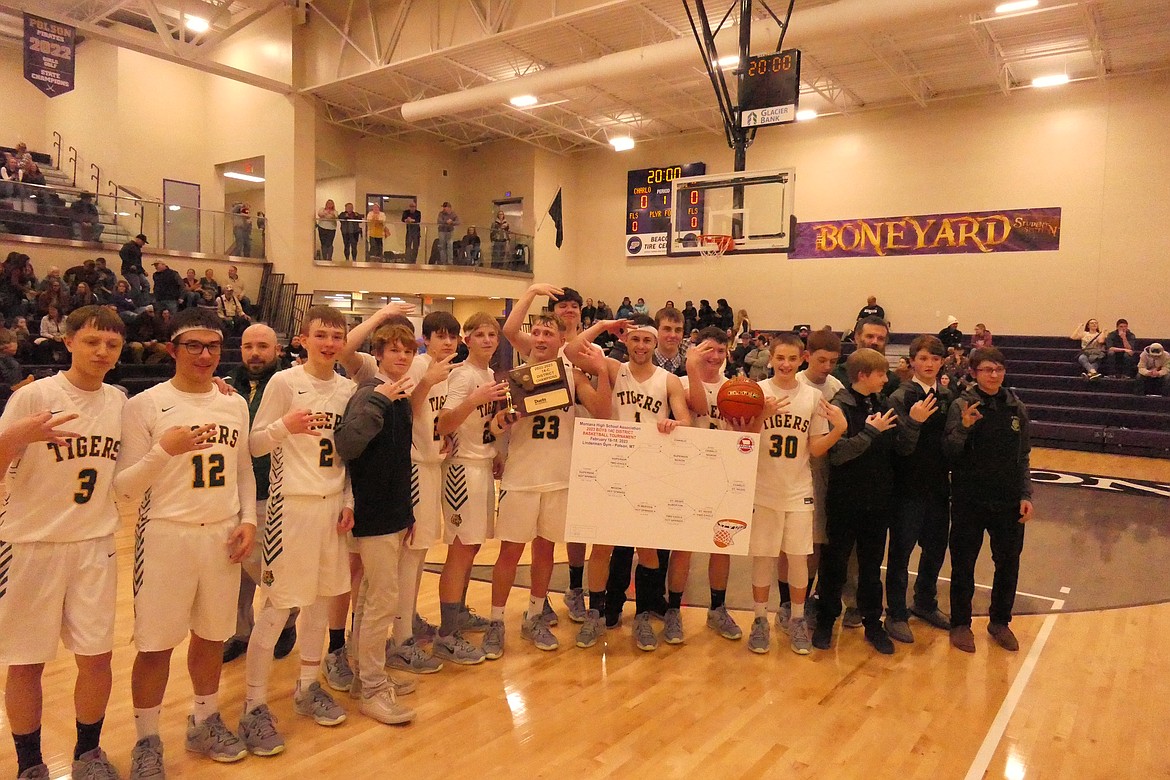 The St. Regis Tigers with their first place trophy and placard following their win over Charlo Saturday night in Polson. (Chuck Bandel/VP-MI)