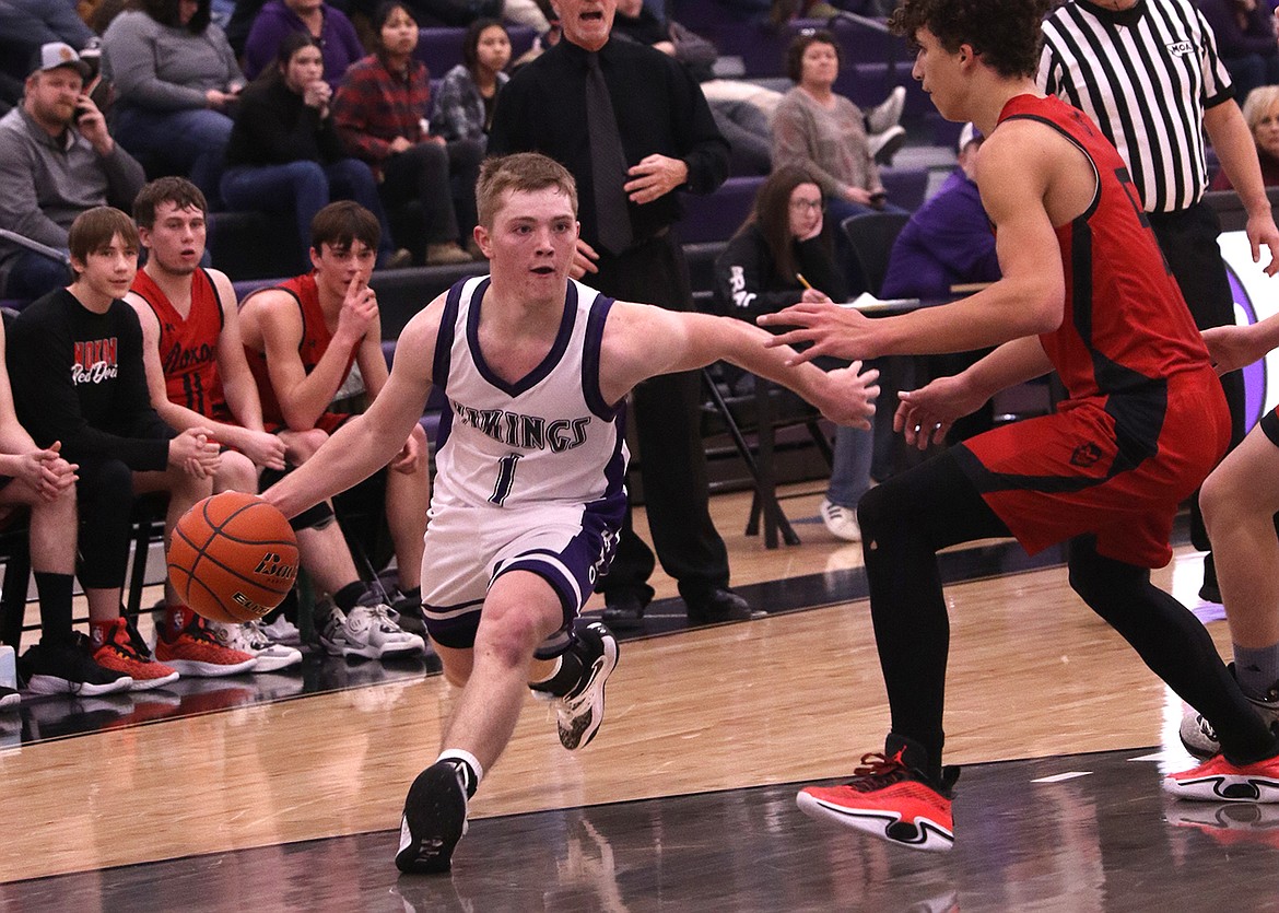 Viking Tucker Love drives by Noxon during last weekend's 14C tournament at Linderman Gym. (Bob Gunderson photo)