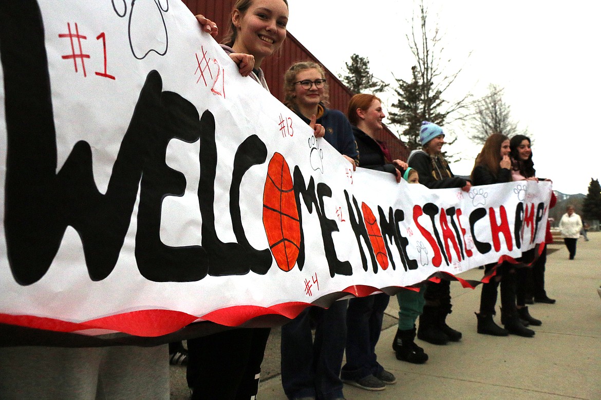 A sign welcomes the Sandpoint High School girls basketball players home after the Bulldogs won the 4A state title, defeating the top-seeded Shelley Russets 69-65 in the state 4A championship Saturday night. The title is the first in program history for the Bulldogs, who went into the tourney as the third-seed.