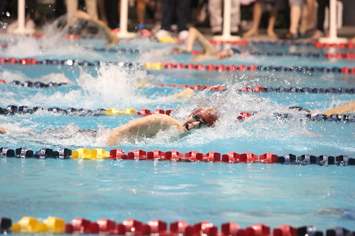 Moses Lake senior Nicholas Moore goes up for air during the 200-yard freestyle finals at Saturday’s State Boys Swim and Dive Championships in Federal Way.