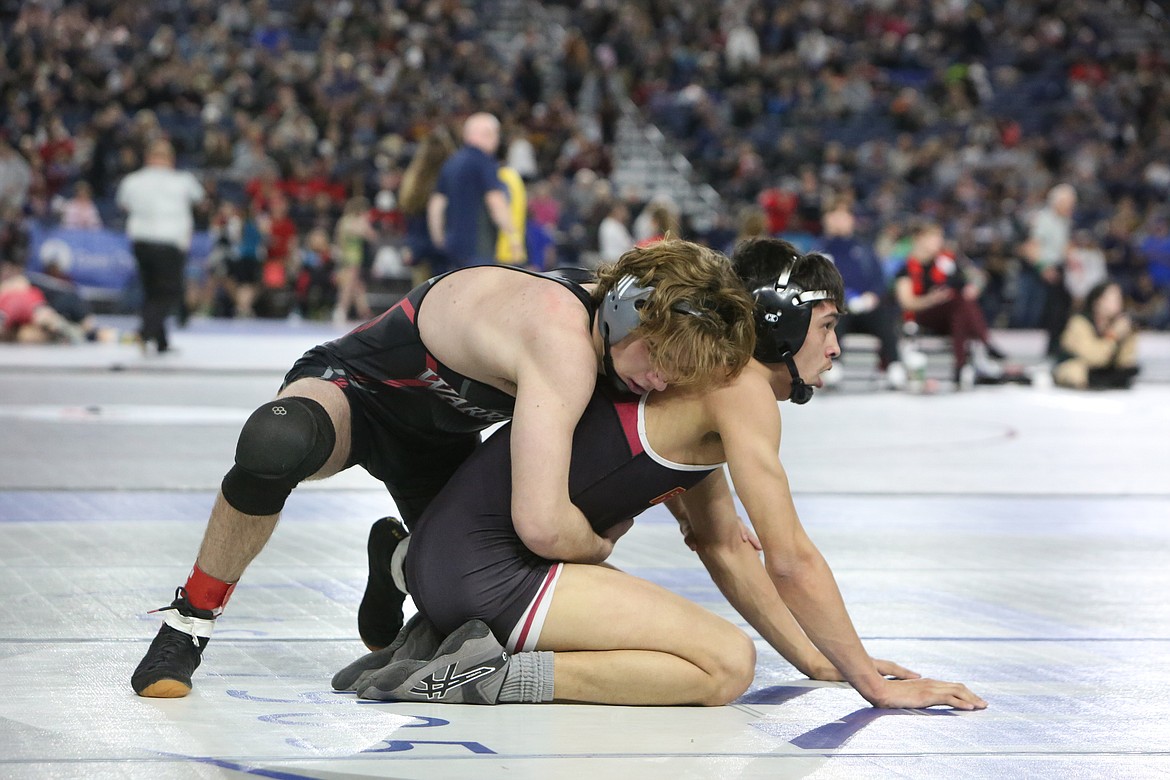 Almira/Coulee-Hartline senior Tristen Wood, left, placed fourth in the 2B/1B Boys 145-pound bracket at the Tacoma Dome for the Mat Classic.