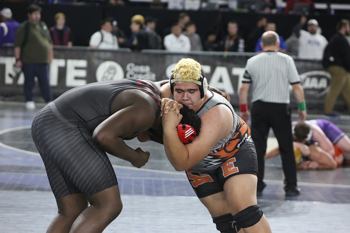 Ephrata senior Jose Pelayo, right, was one of two Tigers to place in the 2A Boys division at the Mat Classic. Pelayo took fourth place in the 2A Boys 285-pound bracket.