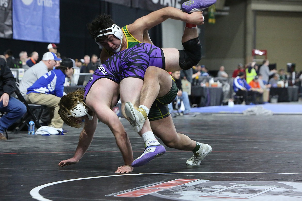 Quincy senior David Medina, background, placed second in the 1A Boys 220-pound bracket at the Mat Classic this weekend. Medina was joined by sophomore Saidt Alvarez as a Jackrabbit placer, who took fourth in the 1A Boys 106-pond bracket.