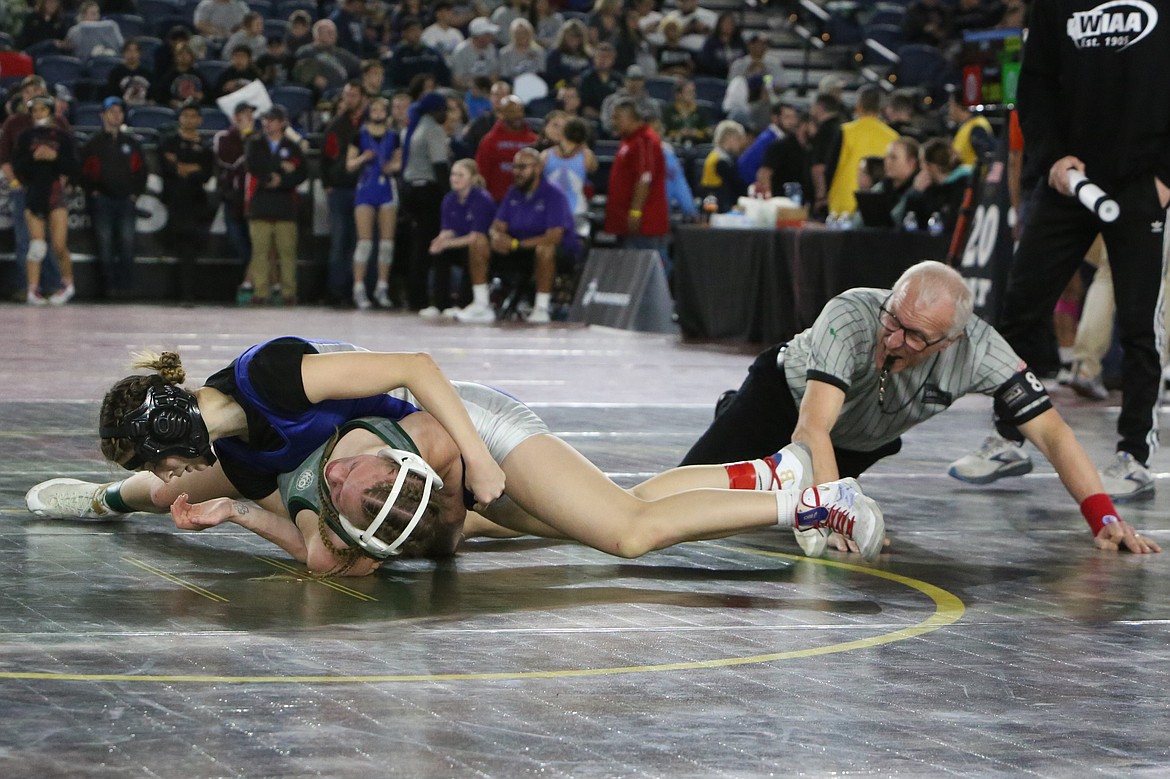 Warden junior Brianalee Martinez, top, placed fourth in the Girls 2A/1A/2B/1B 110-pound bracket at the Mat Classic this weekend.