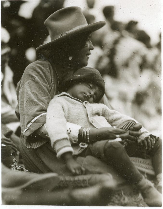 A child sleeps in an adult’s arms. (T.J. Hileman photo/Courtesy of Northwest Montana History Museum)