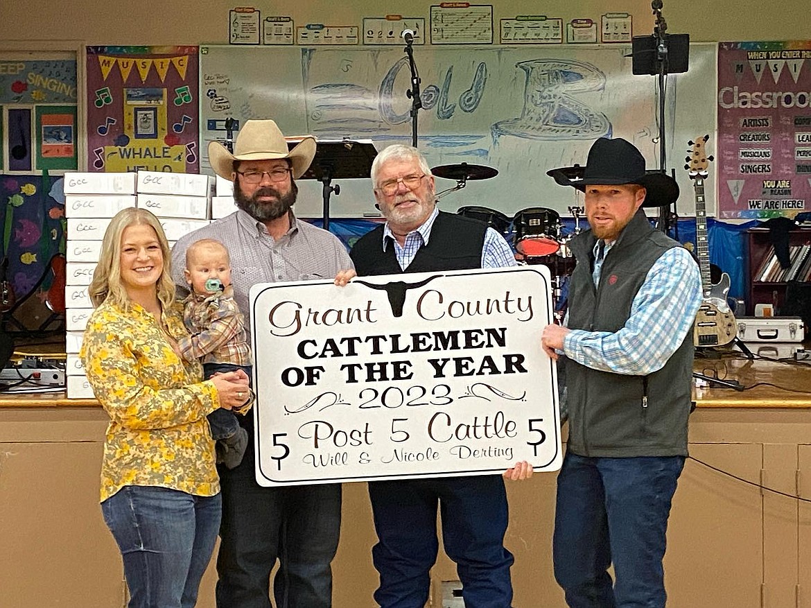 Nicole Derting, left, and Will Derting, second from left, are recognized as the Grant County Cattlemen of the Year for 2023 by the Grant County Cattlemen's Association. Will is a former Cougar football player and the couple operates a meat market in Ephrata.