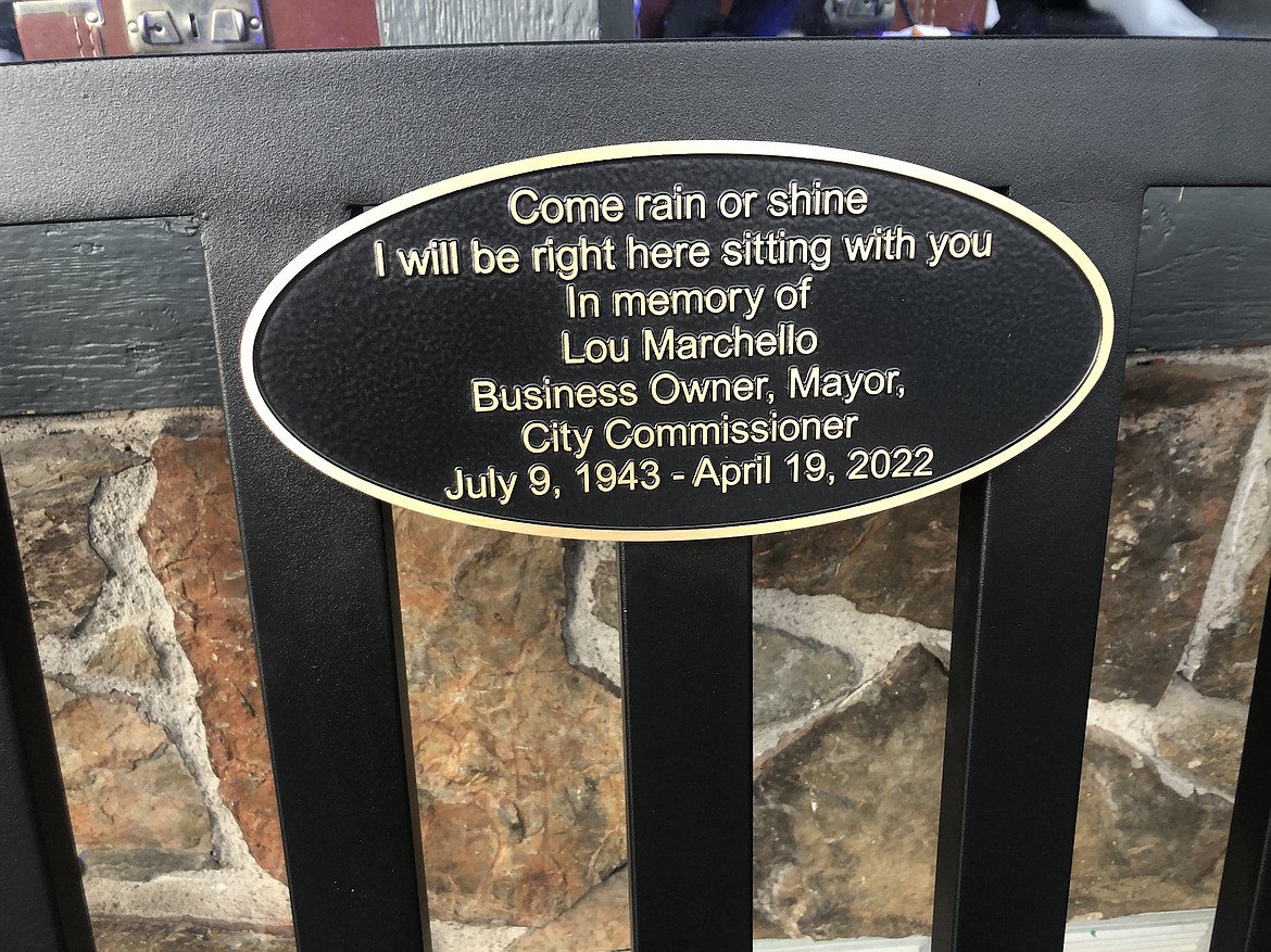 A bench honoring former Polson Mayor Lou Marchello reads “Come rain or shine, I will be right here sitting with you.”