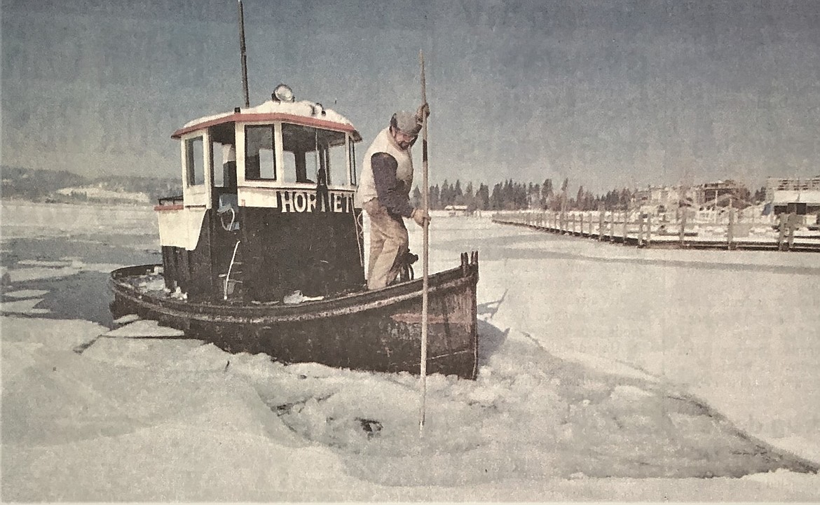 In 1993, Skip Murphy, aboard the Hornet, breaks ice threatening Coeur d’Alene Boardwalk on frozen lake.