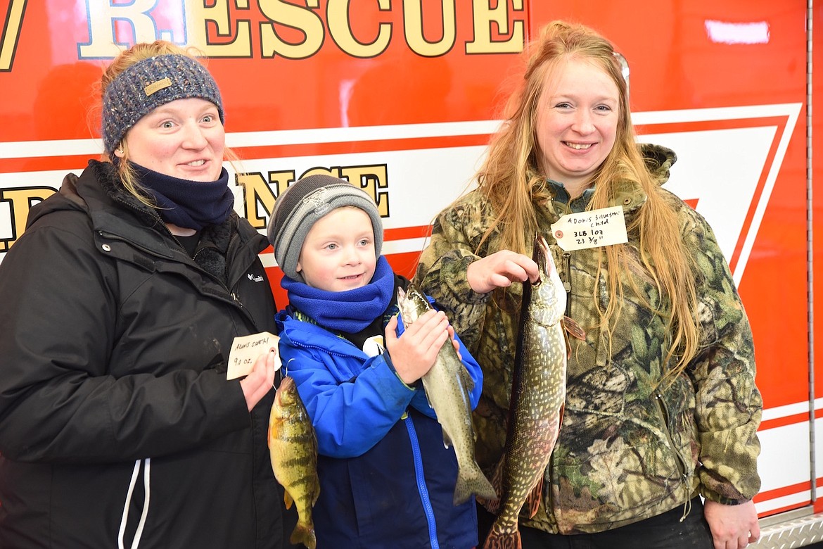 Happy anglers show off their catch during last weekend's Fisher River Valley Fire/Rescue Ice Fishing Derby. (Scott Shindledecker/The Western News)