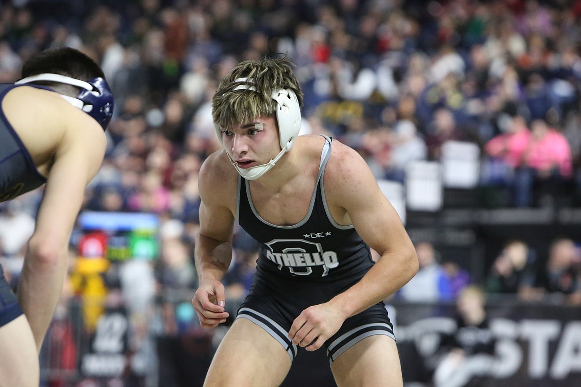 Othello junior Anthony Abundiz tracks his opponent, Burlington-Edison senior Jio Aguilar, at Friday’s 2023 Mat Classic at the Tacoma Dome.