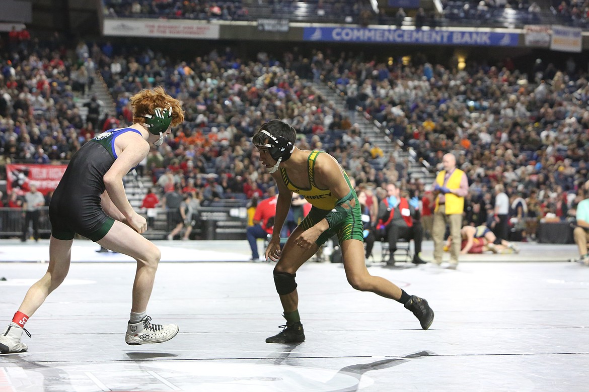 Quincy sophomore Saidt Alvarez, right, wrestles against Konnor Spalding, left, of Lakeside (Nine Mile Falls) during the third round of the 106-pound 1A consolation bracket.