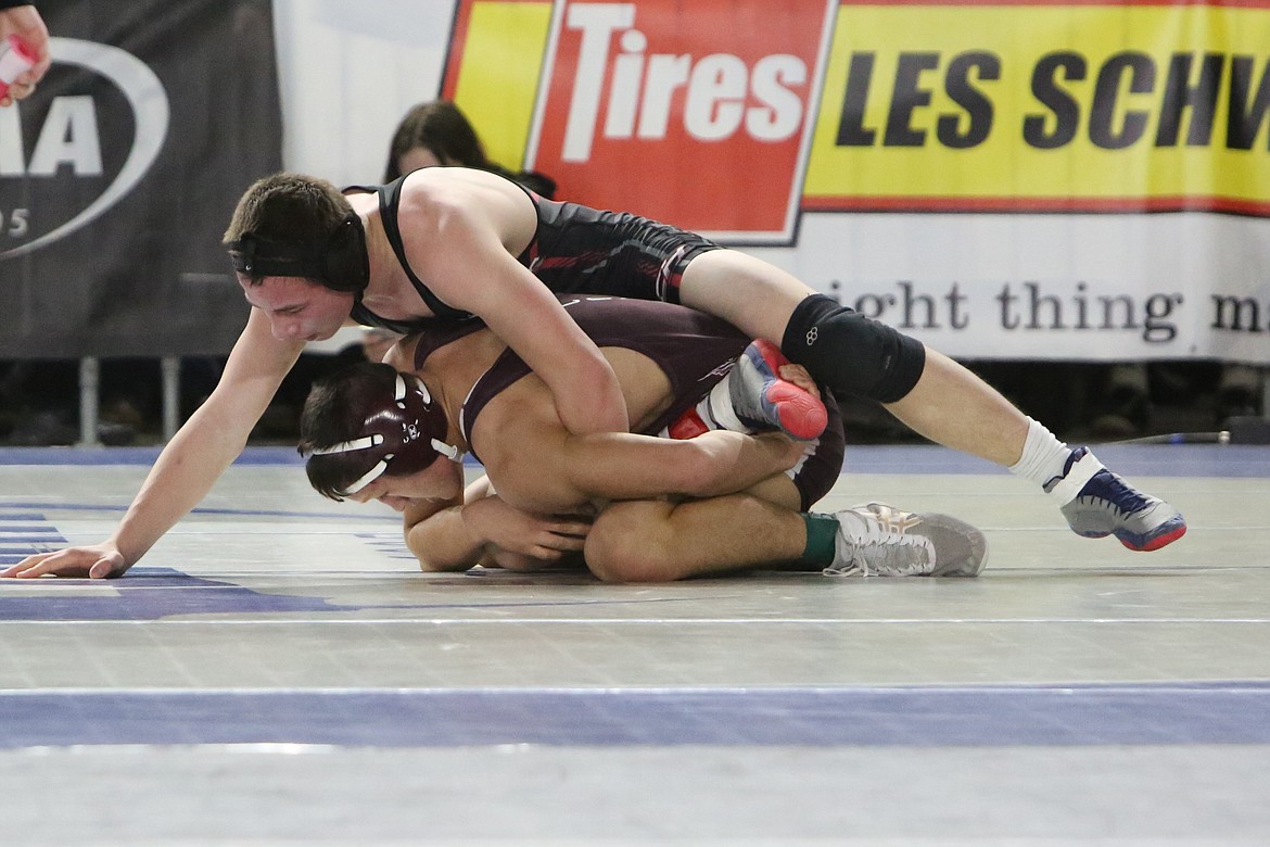 Almira/Coulee-Hartline junior Everett Wood, top, works against his opponent at Saturday’s Mat Classic in Tacoma.