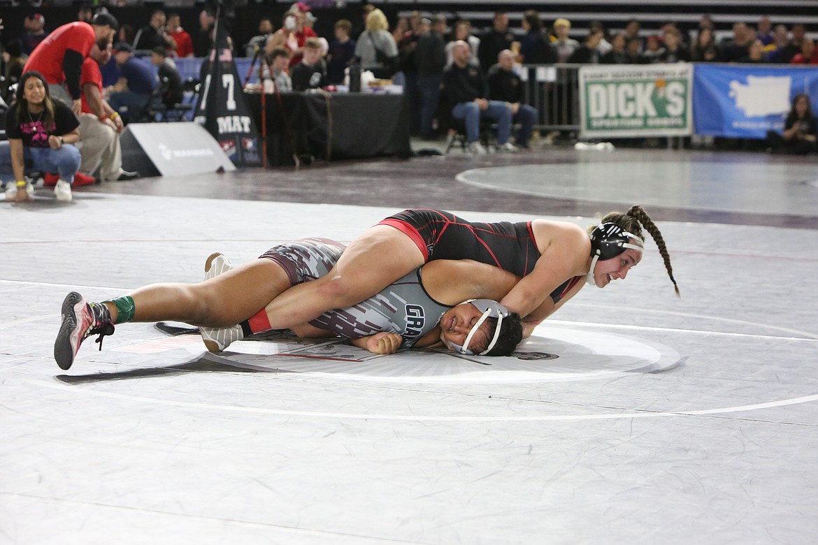 Othello junior Elia Velazquez, top, works against her opponent, Ihanna Perez of Grandview, in the quarterfinals of the girls 2A/1A/2B/1B 190-pound bracket at the Mat Classic.