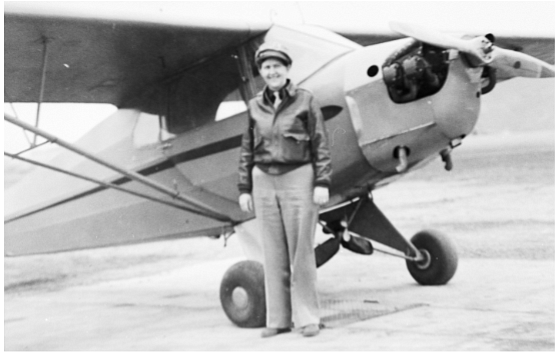 A 1940s photo of Gladys Buroker ready to fly a Piper J-5.