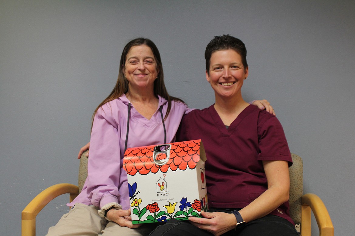 Rebecca Camden, left, and Candice Towles, right, will be donating the can tabs they’ve collected - part of it seven years in the making - to the Ronald McDonald House. They’re pictured with a donation box, because they’ll still be taking donations.