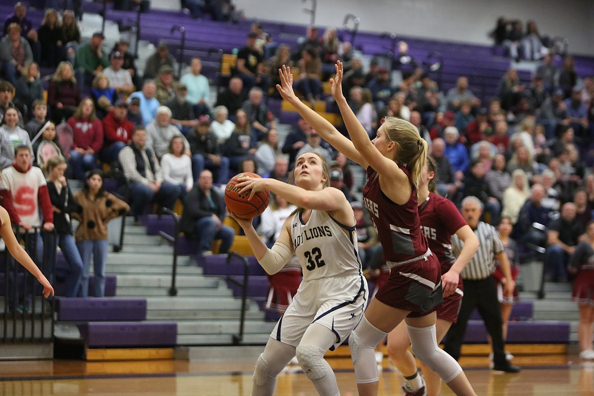 With a Waterville-Mansfield defender draped over her, MLCA/CCS senior McKenna Meise looks for an opportunity for a layup.