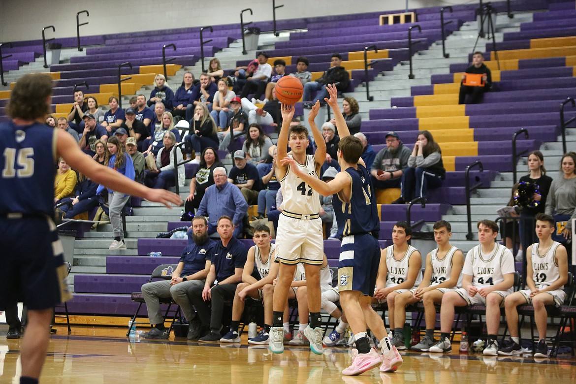 MLCA/CCS senior Michael Podolyn attempts a three-pointer in the third quarter of the Lion’s win over Riverside Christian in the Central Washington 1B title game.