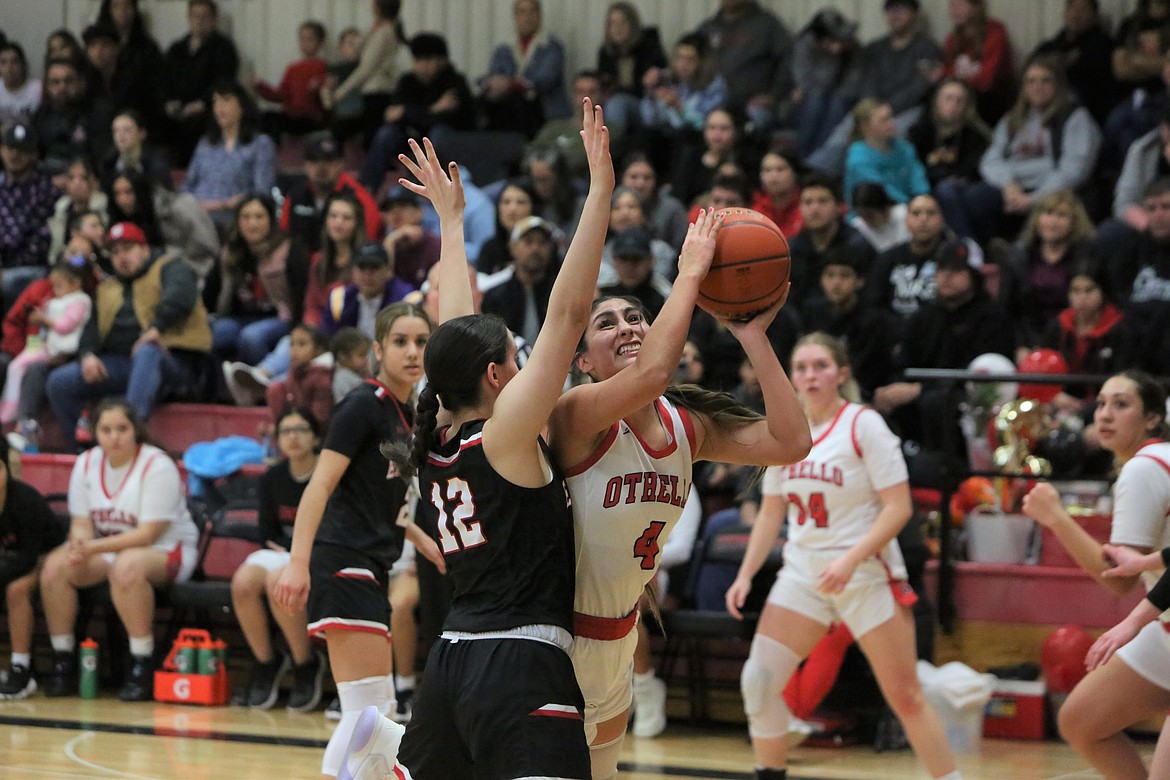 Othello senior Annalee Coronado (4) drives to the rim late in the game against East Valley (Yakima) on Jan. 31.