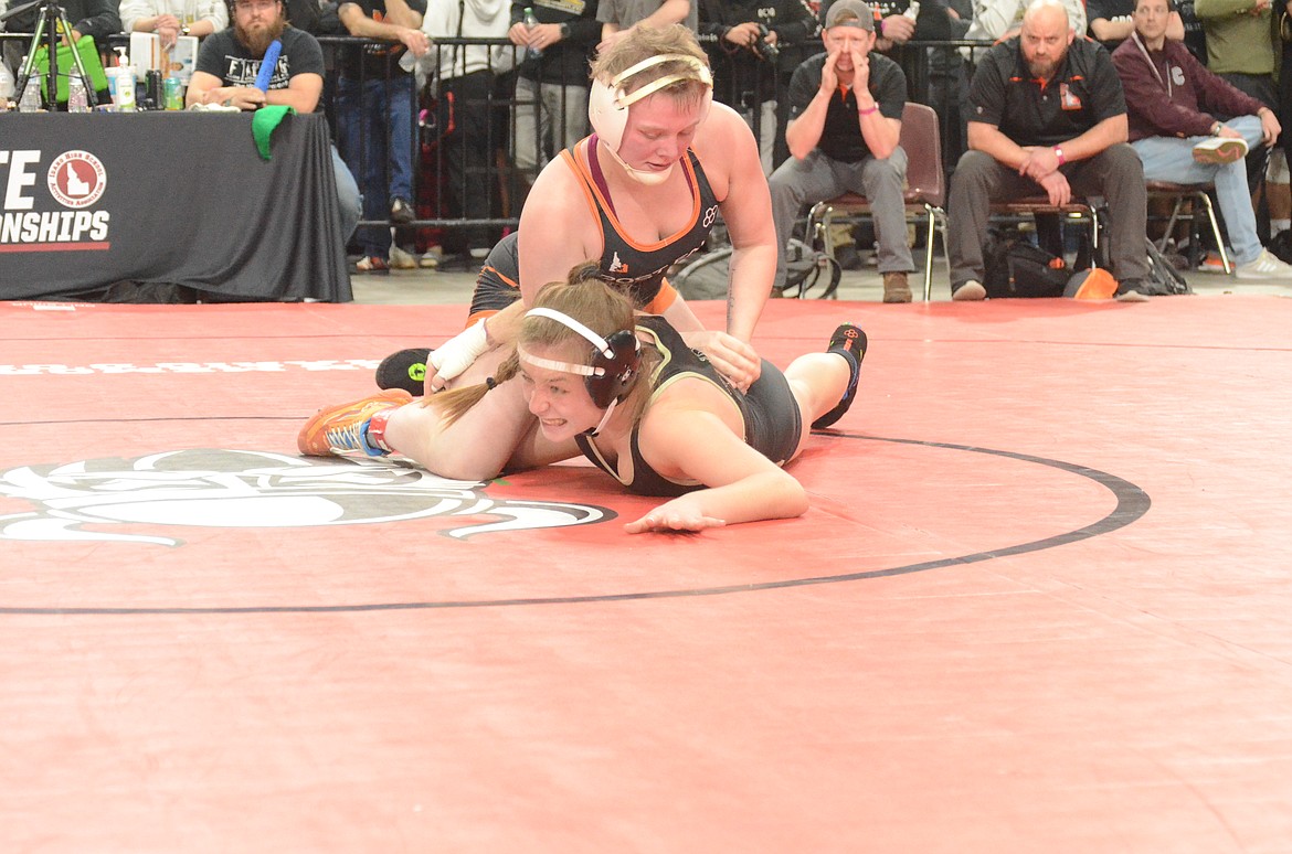 NORM SEE/Special to The Press
Abigale Piper, top, of Post Falls, beat Zoe Fries of Kuna 3-0 in the girls 145-pound semifinals of the state wrestling tournament Friday at the Ford Idaho Center in Nampa.