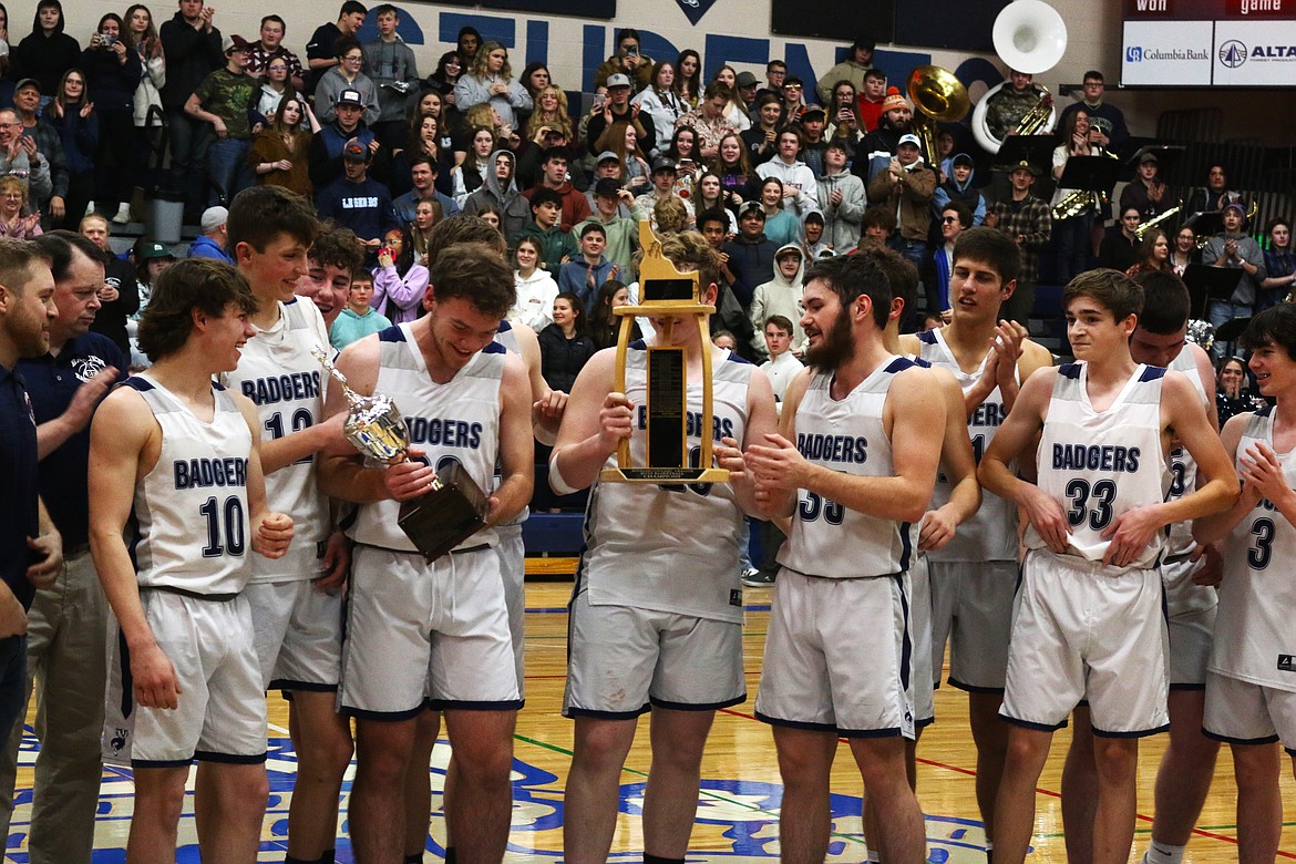 Badgers receive league and district trophies.