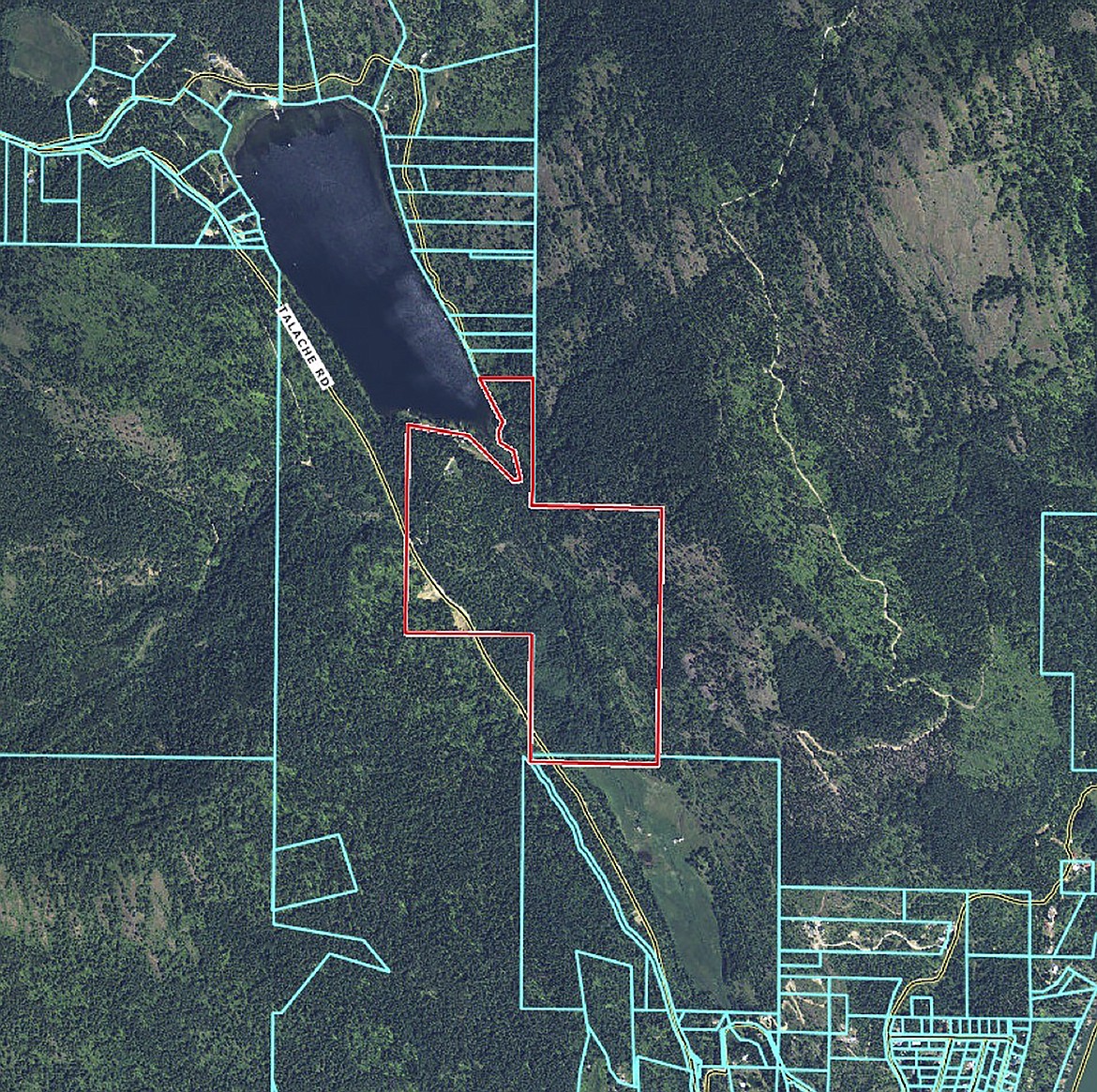 The red outline shows the boundaries of Camp Stidwell. Owned by the Sandpoint Kiwanis Club, the 160-acre site is now protected from through a conservation easement agreement which preserves its original intent as a rustic campground while restricting subdivisions, commercial facilities and other development.