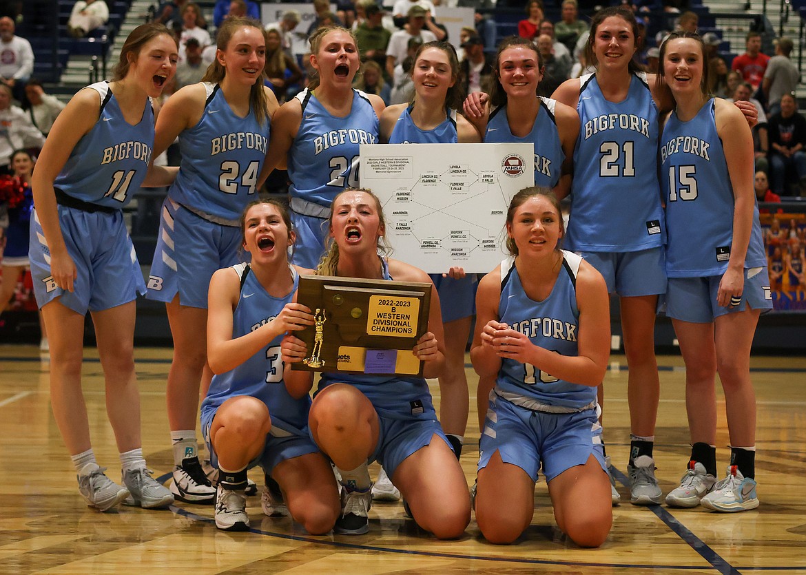 The Bigfork Valkyries celebrate winning the Western B Divisional girls title in Anaconda on Saturday, Feb. 25. (Jeremy Weber/Daily Inter Lake)