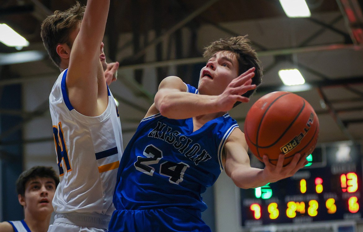 Mission's Zoran LaFrombois goes up for two of his 45 points against Thompson Falls to lead the Bulldogs to the consolation title at the Western B Divisional Tournament in Anaconda on Saturday, Feb. 25. (Jeremy Weber/Daily Inter Lake)