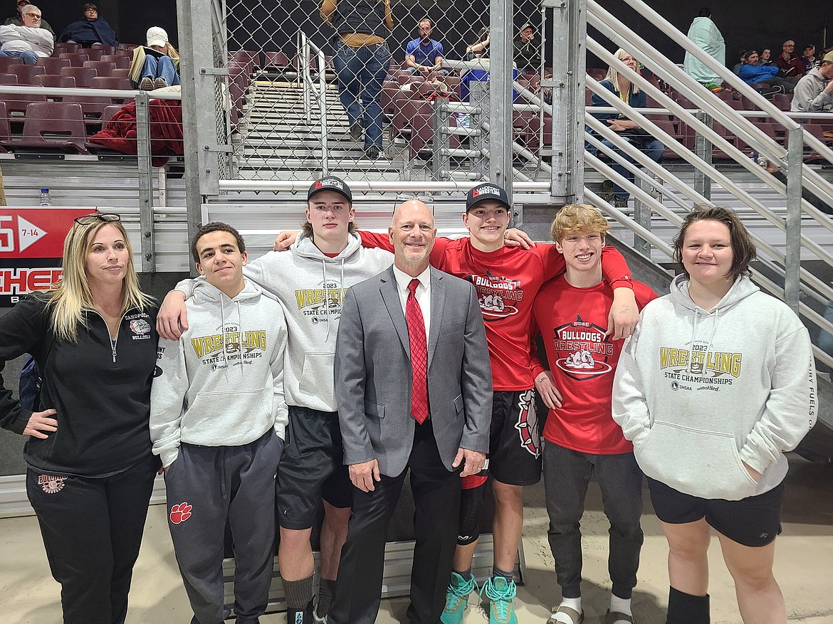 Sandpoint High School wrestling coaches and placers pose for a photo at the state tournament on Saturday. Pictured, from left, are girls wrestling coach Vali Johansen, Ashlei Hawkins (126), Calvin Hinds (182), boys coach Doug Fry, Jorden Tyler (195), Shane Sherrill (138), and Grace Balch (G 235).