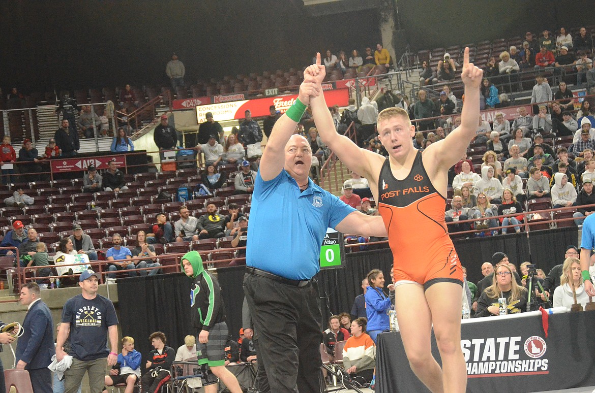 NORM SEE/Special to Hagadone News Network
Post Falls senior Trevor Miller celebrates after pinning Cash Weeks of Middleton in the 5A 220-pound final at the state wrestling championships Saturday at the Ford Idaho Center in Nampa.