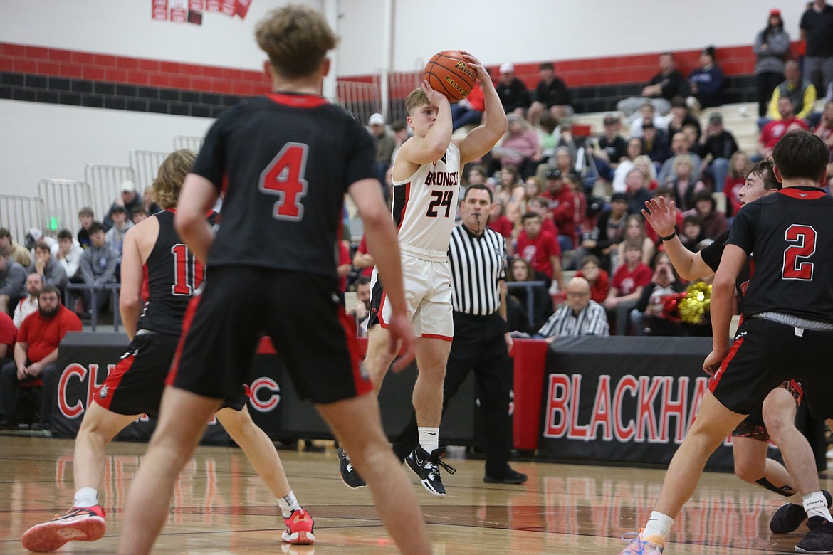 Lind-Ritzville/Sprague junior Brock Kinch (24) attempts a three-pointer in the first quarter against Dayton-Waitsburg.