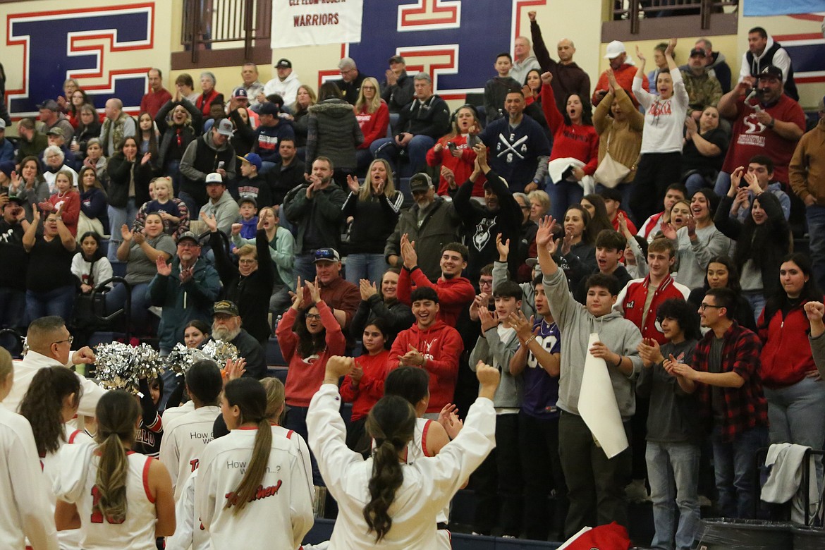 Members of the Othello crowd cheer on the Huskie girls basketball players after their 45-39 win over Mark Morris in Ellensburg.