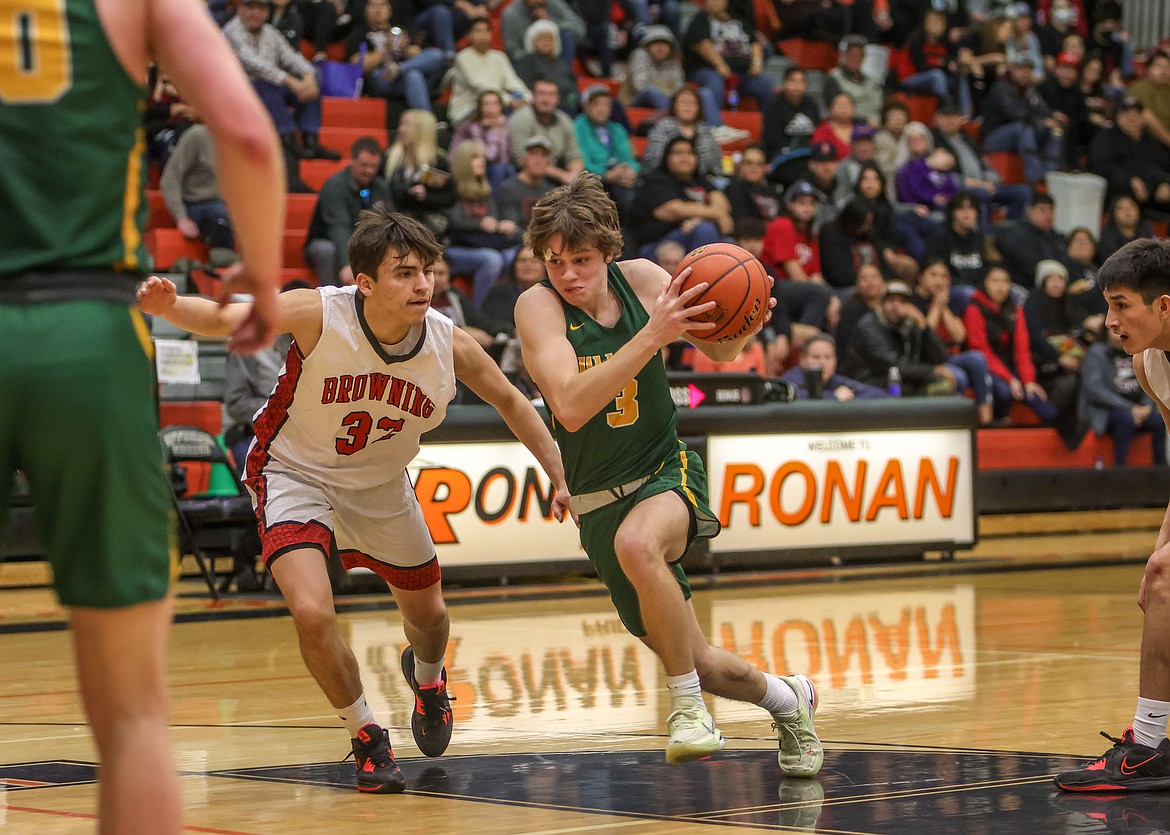 Sophomore CJ Thew drives towards the basket on Friday in the Western A Divisional Tournament in Ronan against Browning. (JP Edge photo)