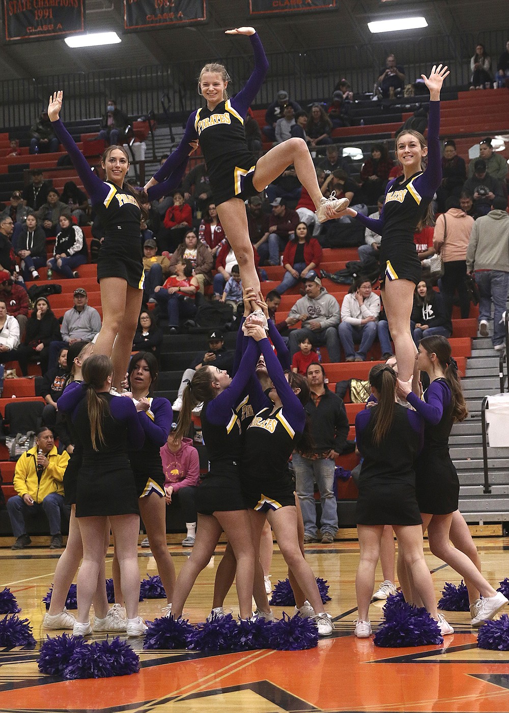 The Polson's Cheer Team roots for the Pirates at last week's Class A Divisional Tournament in Ronan. (Bob Gunderson photo)