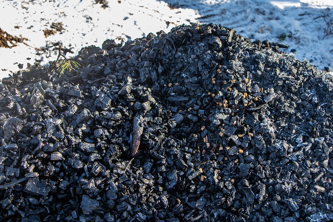 Biochar is seen from the CharBoss. The CharBoss is a machine that converts woody material into biochar, a nutrient rich soil additive. (Kate Heston/Daily Inter Lake)