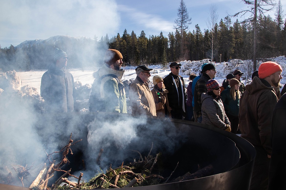 Smoke from the smaller kiln is seen during a CharBoss presentation on Feb 16., 2023 near Coram. (Kate Heston/Daily Inter Lake)