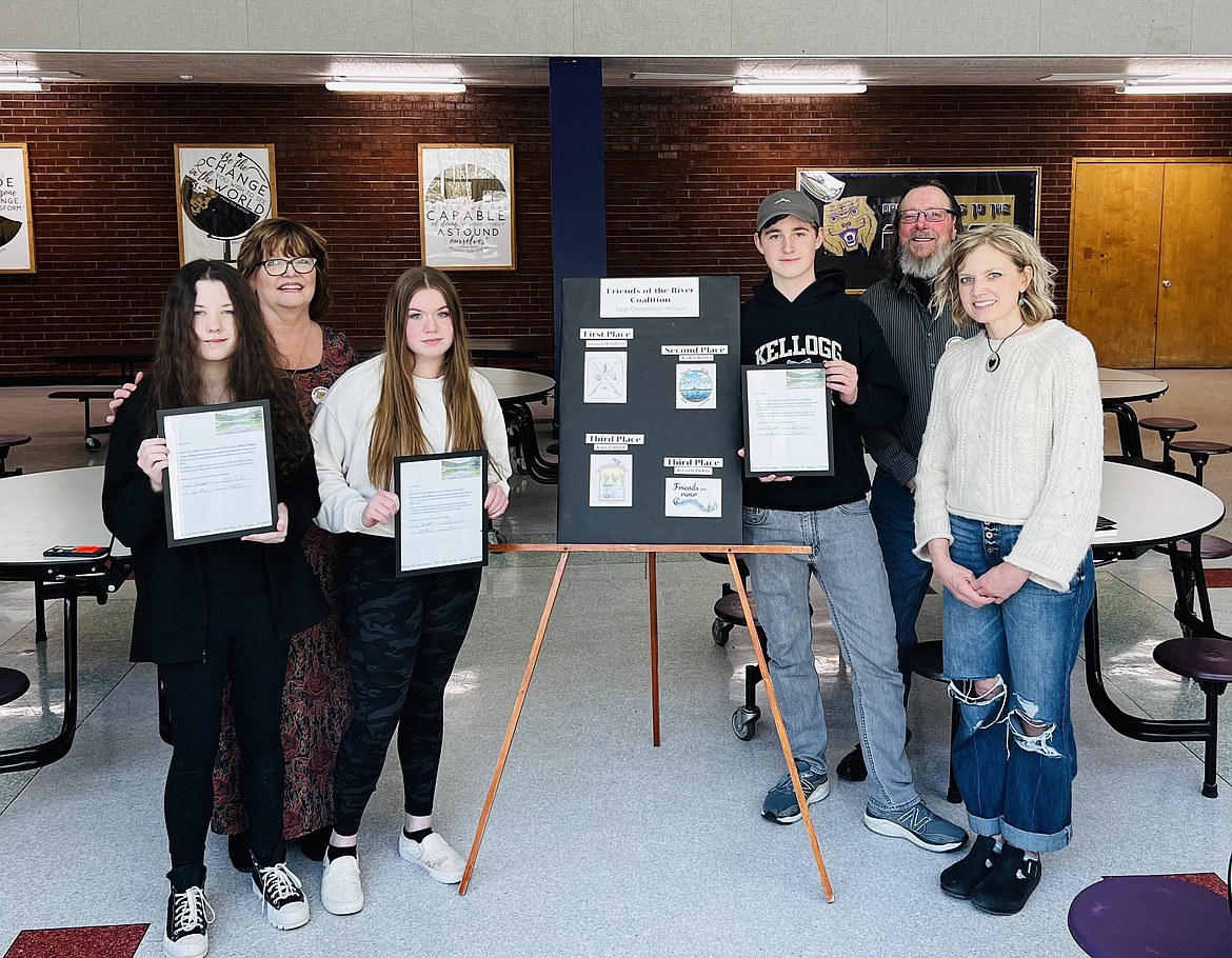 Kellogg High School art students Kaia Palmer, Lena Erlendson, and Kaden Keller were honored during an assembly last week for their recently created logos for the Friends of the River Coalition (FORC). Along with Russell Fields (not pictured), the four winners were chosen out of several submissions to have their logos featured on hats, shirts, mugs, and other FORC promotional items. Pictured from the left are Palmer, FORC president Dawn Wiksten, Erlendson, Keller, FORC vice president Rob Archer, and KHS art teacher Rachel Krusemark.