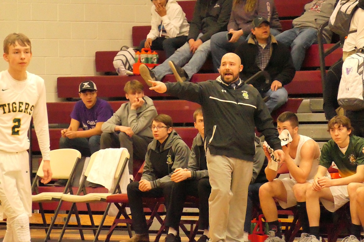 St. Regis coach Jesse Allan directs traffic while eighth grade standout Conner Lulis heads up court during the Tigers game vs Darby Saturday morning in Butte. (Chuck Bandel/MI-VP)