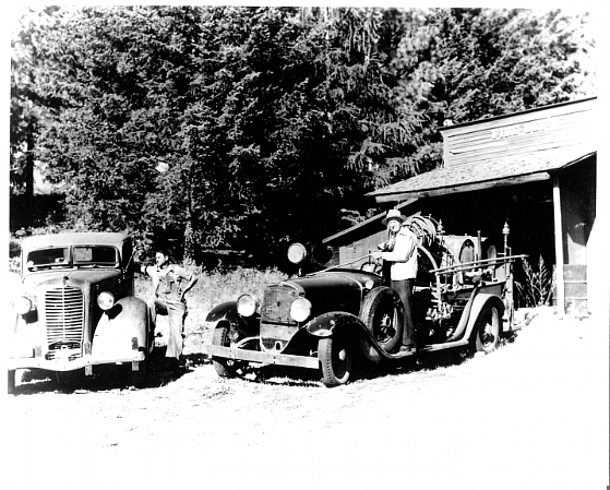 The first fire hall with the “Old No.1 fire engine. (Credit – Bigfork Volunteer Fire Department)