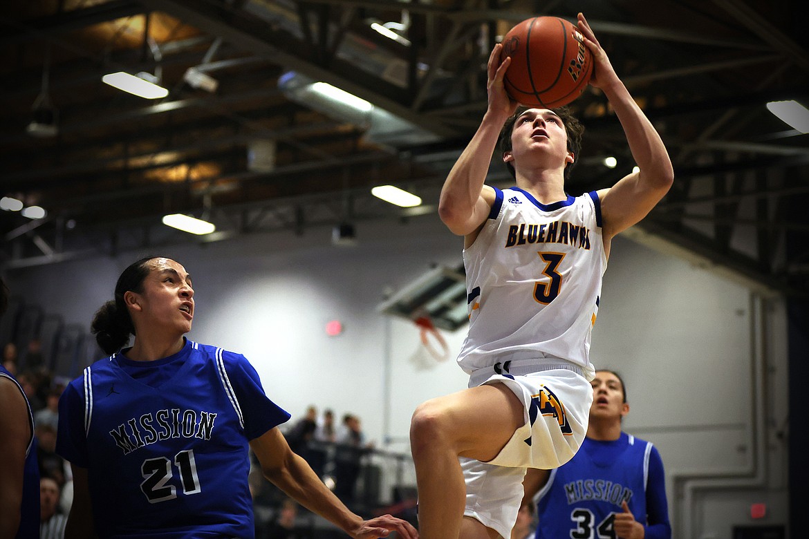 Bryson LeCoure drives in for a Thompson Falls layup during action at the Western B Divisional Tournament in Anaconda over the weekend. (Jeremy Weber/Bigfork Eagle)