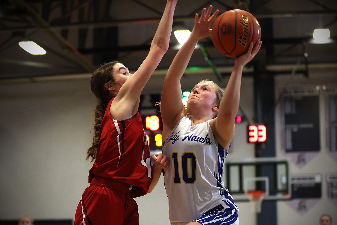 Thompson Falls guard Chesney Lowe drives in for a tough layup against Loyola during action at the Western B Divisional Tournament in Anaconda over the weekend. (Jeremy Weber/Bigfork Eagle)