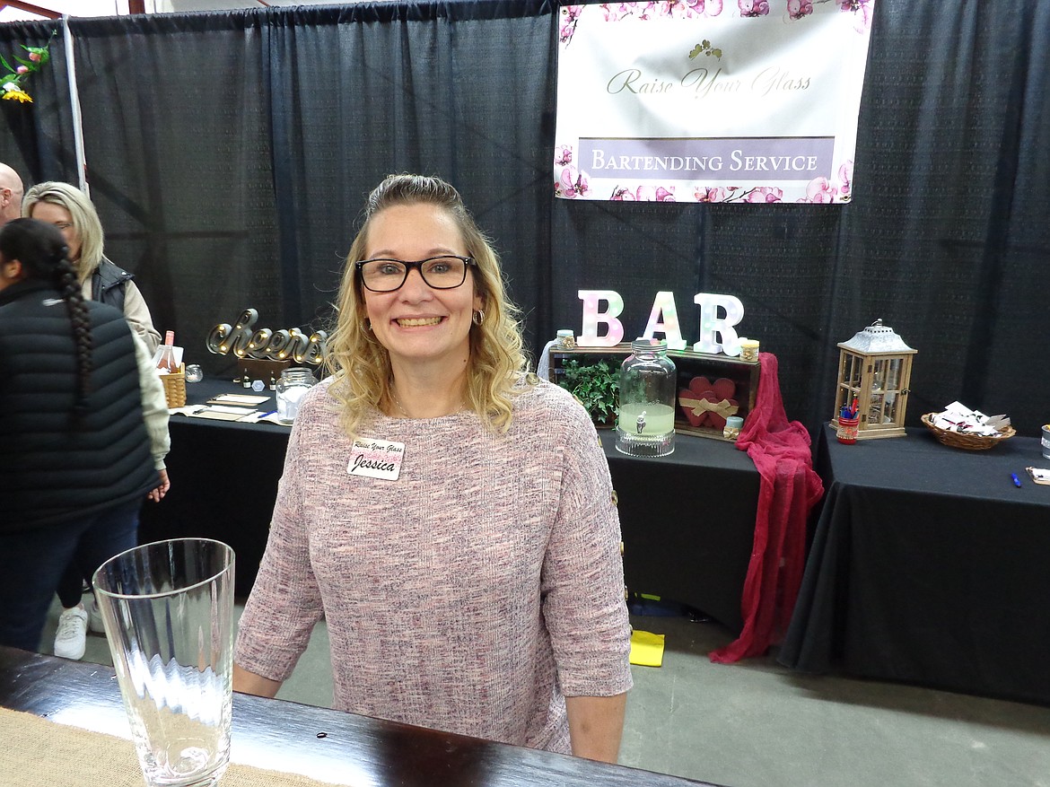 Jessica Ramynke behind the portable bar her Yakima-based company, Raise Your Glass, uses to provide drinks at events. “We have 12 bartenders that we have access to right now, most of them are family and friends, so we can pick up and go wherever you need us,” she said.