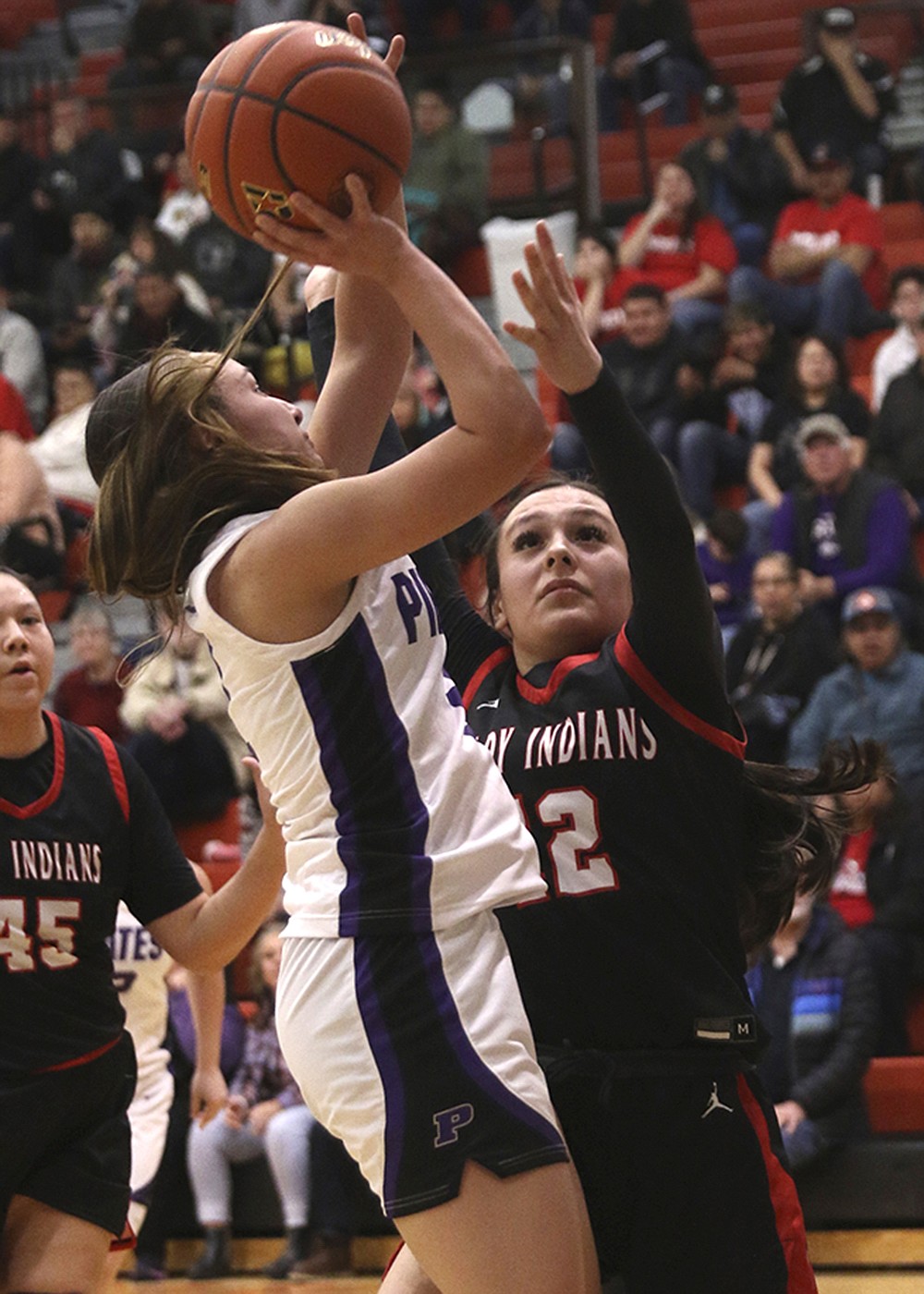 Polson's Julia Barnard, who returns to the Lady Pirates as a senior, goes up for two points against Browning during last winter's Class A Divisional Tourney in Ronan. (Bob Gunderson photo)