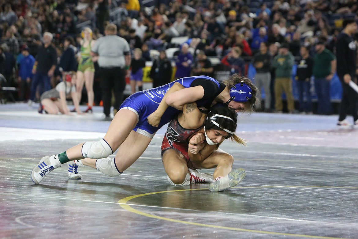 Warden junior Jada Hernandez, left, took fourth in the 2A/1A/2B/1B girls 115-pound bracket at the 2023 Mat Classic.