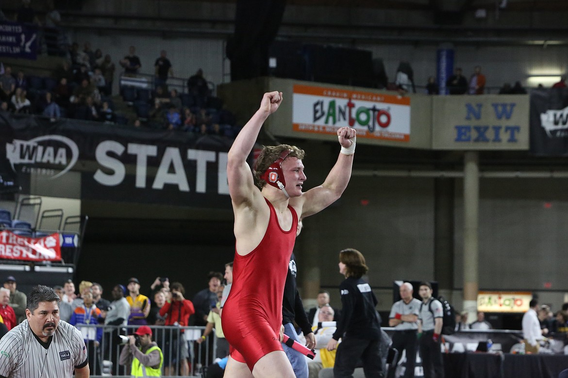 Othello senior Terrill Freeman throws up his arms after winning a state title in the 2A boys 195-pound bracket.